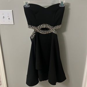 Black strapless mini dress with beaded cut outs